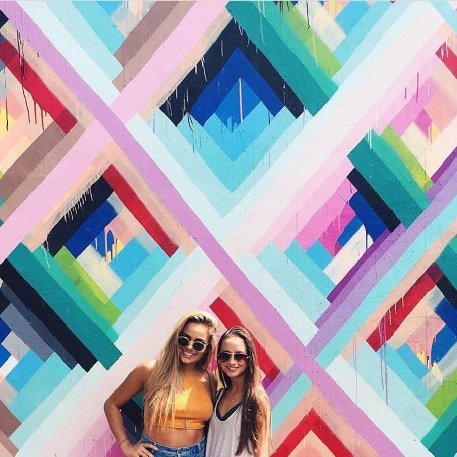 Dance juniors Francesca Gabriel and Reagan Domino pose in front of a mural in Miami’s Wynwood Art District. “Now that its summer, I feel like I have full freedom to explore new places and acquire new experiences,” Domino said. “Being in a pair of awesome sunglasses with your best friends by your side definitely doesnt hurt.” 