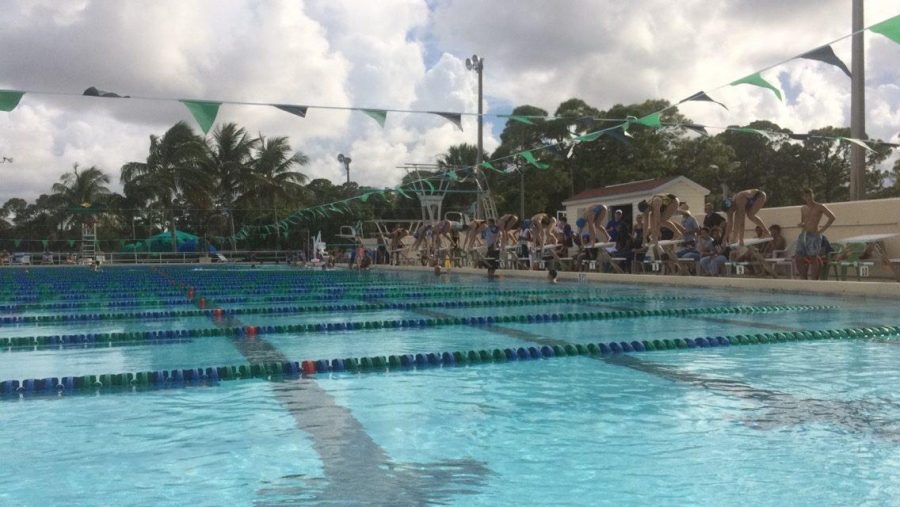 Competing swimmers ready themselves for the start of the girls 200-meter individual medley in the first swim meet of the season on Friday, Aug. 26.