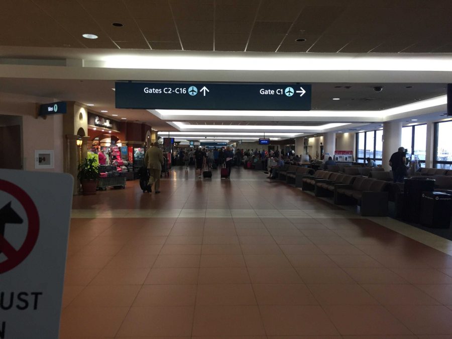 Communications senior Michael Wang prepares to leave his new friends and experiences from camp behind as he journeys through the airport on his trip home.