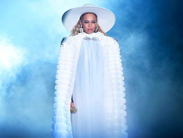 Beyoncé starts out a medley performance of her album, Lemonade, in an all white outfit.