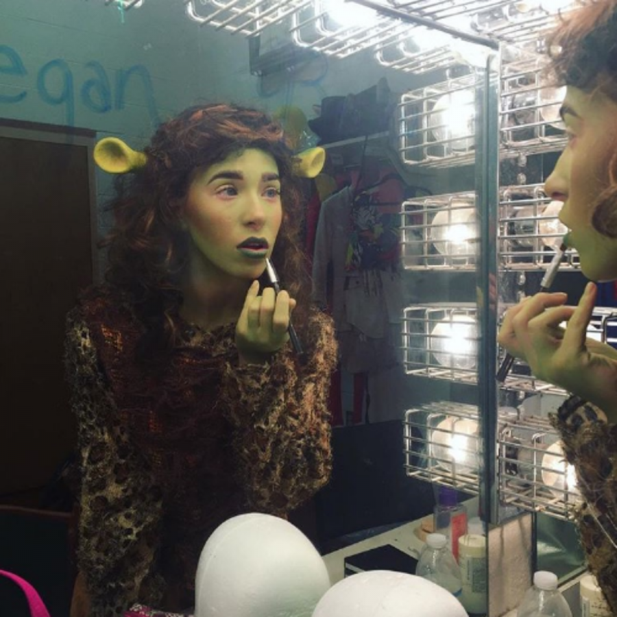 Theatre junior Skyler Sajewski applies stage makeup to portray the character Mama Ogre in Shrek: The Musical. During her sophomore year, Sajewski was cast as Mama Ogre and understudy to Fiona, one of the primary protagonists in the play. 