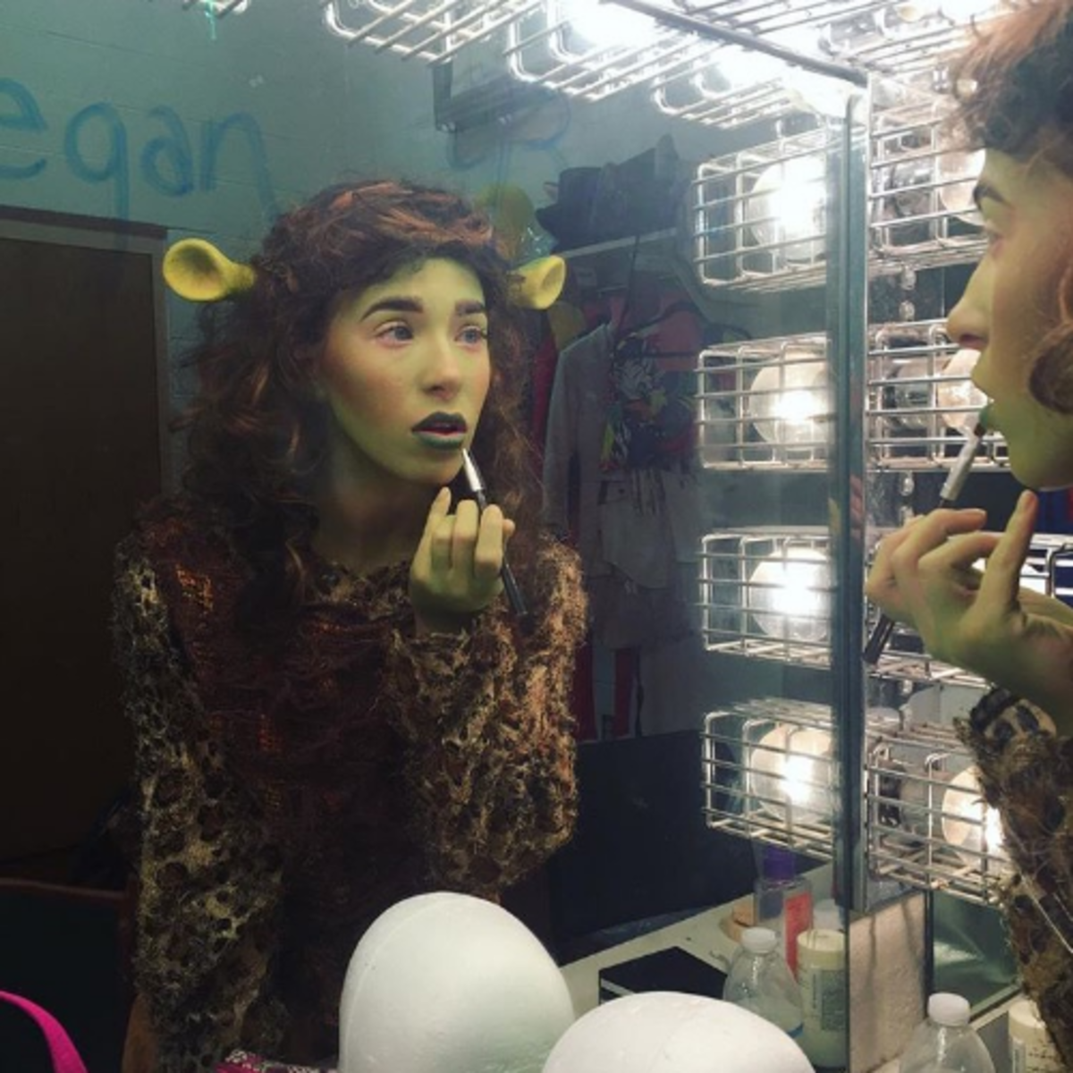 Theatre junior Skyler Sajewski applies stage makeup to portray the character Mama Ogre in Shrek: The Musical. During her sophomore year, Sajewski was cast as Mama Ogre and understudy to Fiona, one of the primary protagonists in the play.
