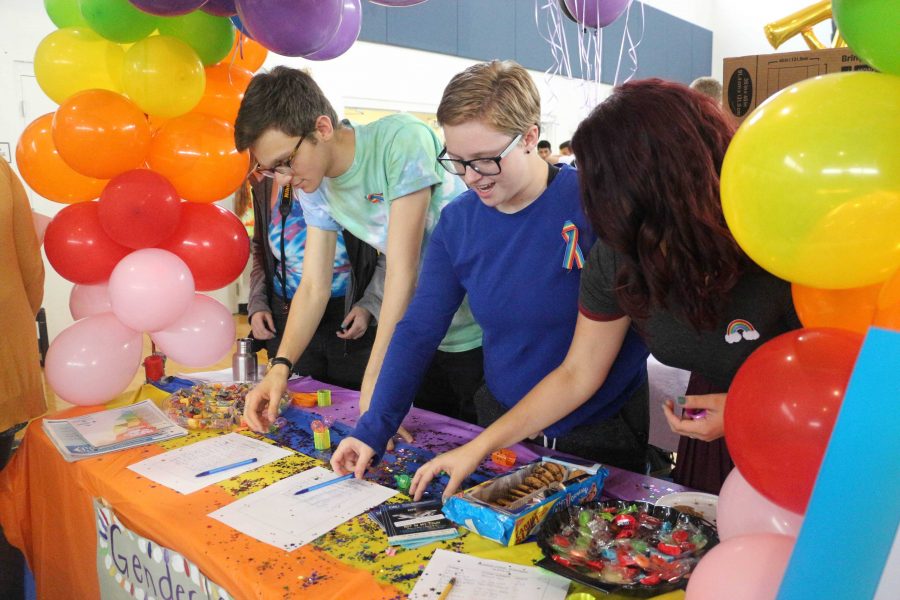 (L-R) Communications senior, Matthew Nadel, communications sophomore, Eli Anderson and theatre senior, Suzanne Litwinka prepare The Gender and Sexuality Alliance Clubs table for Club Rush. In the Gender and Sexuality Alliance, we hope to create a supportive space for queer and ally students at Dreyfoos and to work with faculty and administration to make Dreyfoos an inclusive and safe place for all students. Every student, regardless of gender, sexuality, or any other factor, deserves safety and the opportunity to succeed in school. The Gender and Sexuality Alliance is here to ensure that, Nadel said. Students could sign up for various clubs, run by their fellow peers, at Club Rush on Sept. 20th.