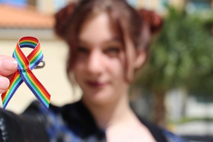 Communications sophomore Rebecca Nir supports GSA’s celebration of ally week. “Today we are having DSOA students sign to support the safety of all LGBTQ+ students on campus and they can pick up ally stickers and pins to show a visually accepting space,” club president and communication senior Matt Nadel said.