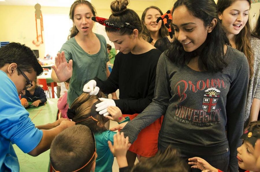 Strings junior Emmie Bruderer (L-R), theatre senior Valentina Diaz, vocal senior Gabrielle Cowen, vocal junior Mounika Vatigunta, and communications junior Savannah Quintana interact with young kids at the Spanish Honor Societys first field trip of the year. Students of the honor society spent their lunch period at the Luciano Martinez Child Development Center helping to get the kids in the Halloween spirit with crafts that included decorating bat headbands and pumpkins.