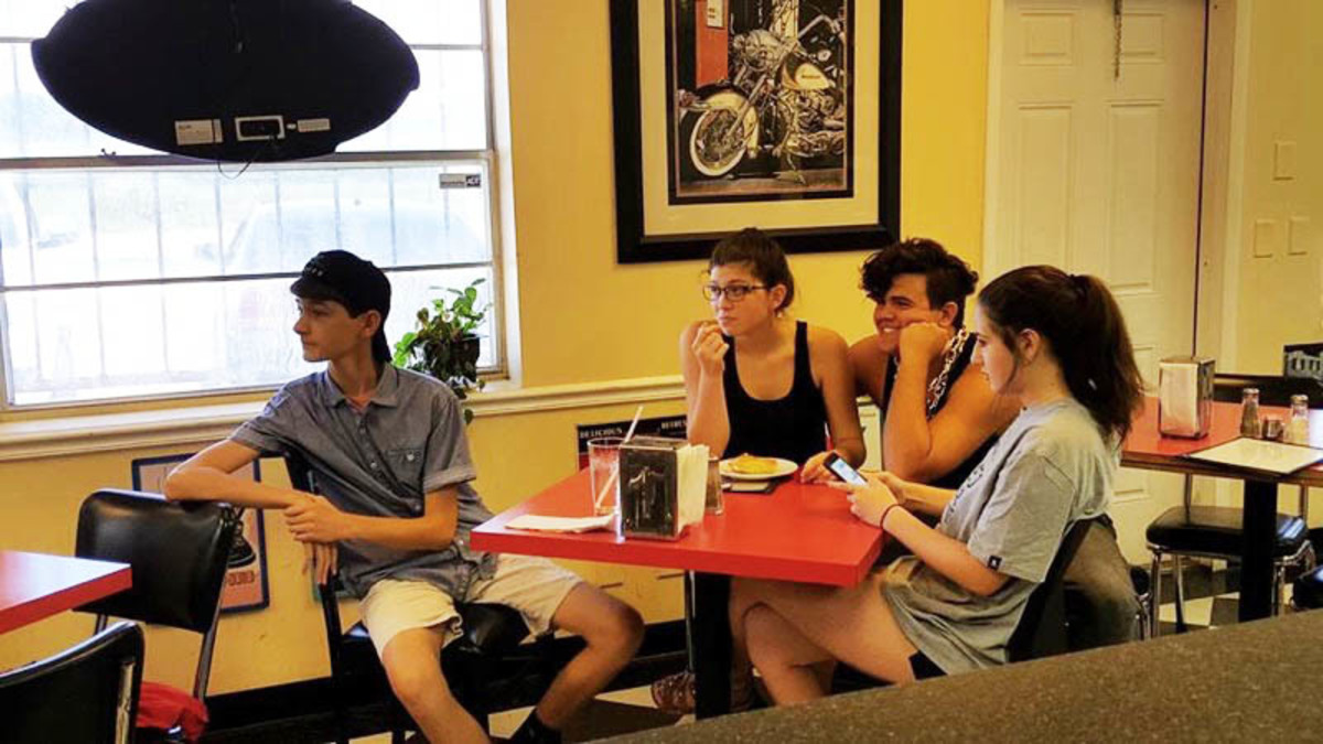 Theater sophomore Quinn Doyle (left) spends time with fellow cast mates while shooting King of the Streets.