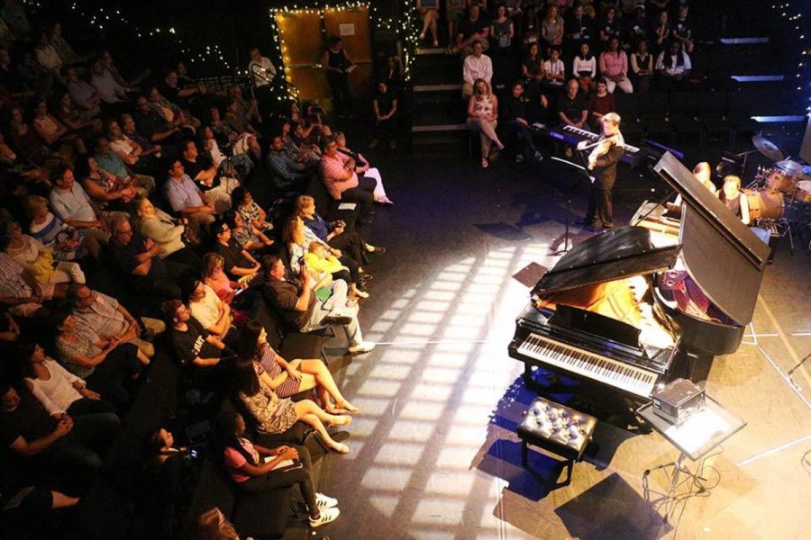 The Brandt Black Box Theater is packed to the brim as students, faculty, relatives, and friends gather to watch the annual Impromptu concert. 