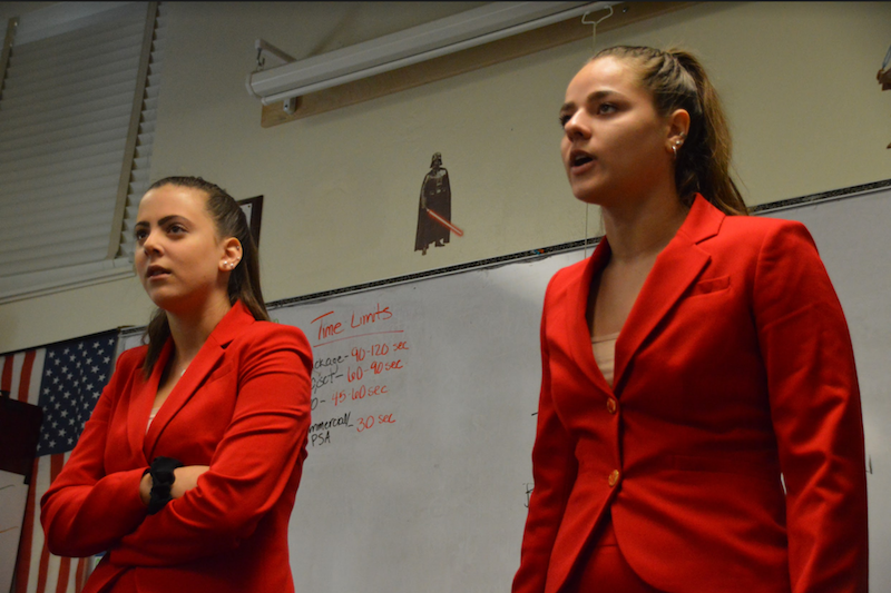 Communications junior Ariel Gordon and communications senior Kayla Gallagher perform a Duo Interpretation piece entitled “Thistle Blossoms,” topping off the performance with flamboyant red skirtsuits. 