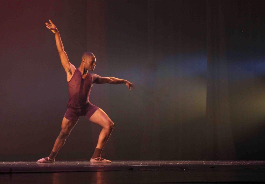 Dance senior Darius Hickman performs during the dress rehearsal of the Fall Dance Concert.