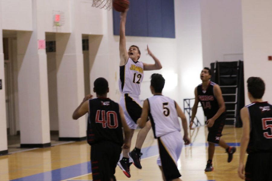 Communications senior Riley OConnor drives in for a layup.