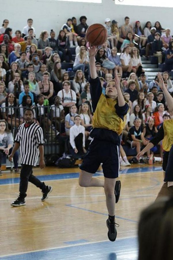 Theater junior Riley Russell goes up for a layup in the powder puff basketball game.