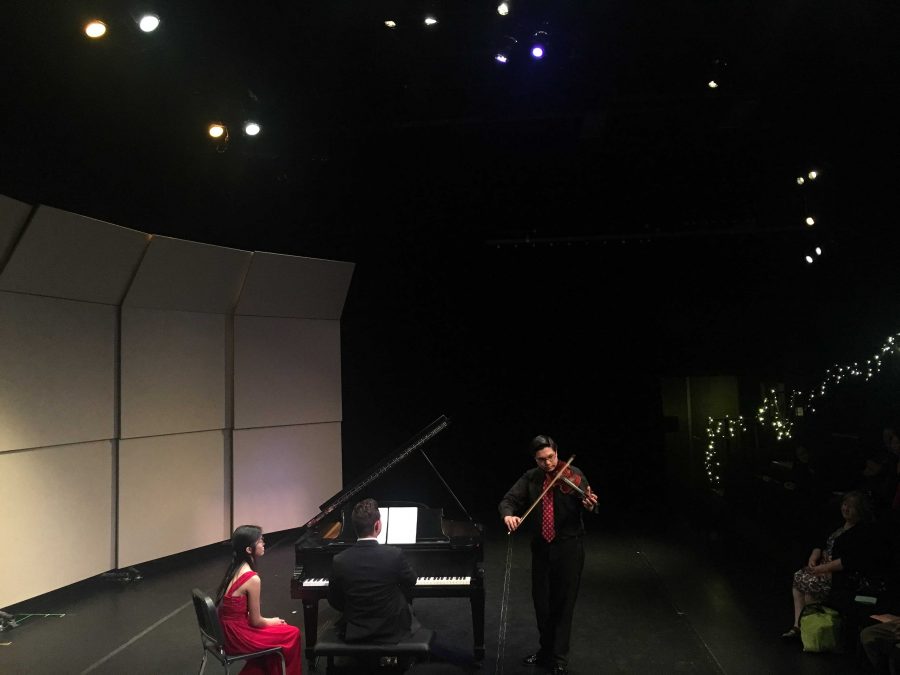 Piano senior Paul Richter collaborating with strings junior Matthew Hakkarainen.