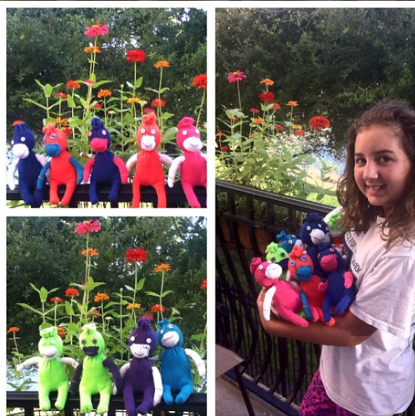 Garboden models with the sock monkeys she created for her aunt’s special needs class.