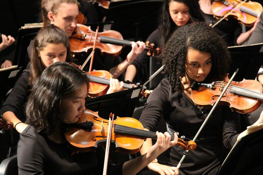 Strings freshmen Hannah Xie (left) and Abigail McNutt perform in the String Orchestra concert held on Feb. 17 in the Brandt Black Box Theater.