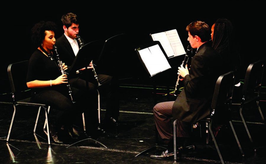 Band+juniors+Maydeleen+Guiteau%2C+Adam+Freedman%2C+Hailey+Ray%2C+and+senior+Ben+Sullivan+play+clarinets+at+the+Chamber+Winds+concert+on+Feb.+23.+