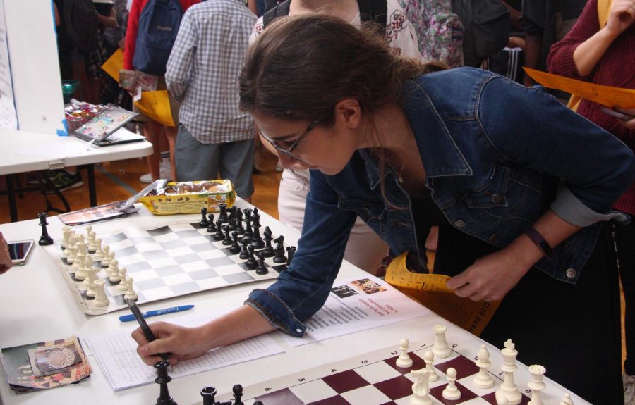 Vocal sophomore Jackie Kaskel signs up for Chess Club at Club Rush. Students had the opportunity to learn more about all 78 of Dreyfoos’ clubs at the event. 