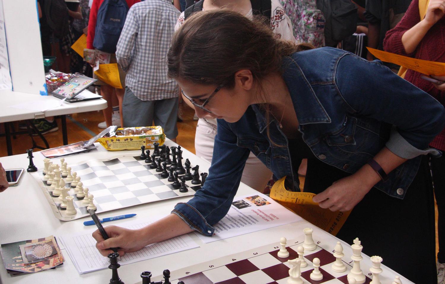 Vocal sophomore Jackie Kaskel signs up for Chess Club at Club Rush. Students had the opportunity to learn more about all 78 of Dreyfoos’ clubs at the event.