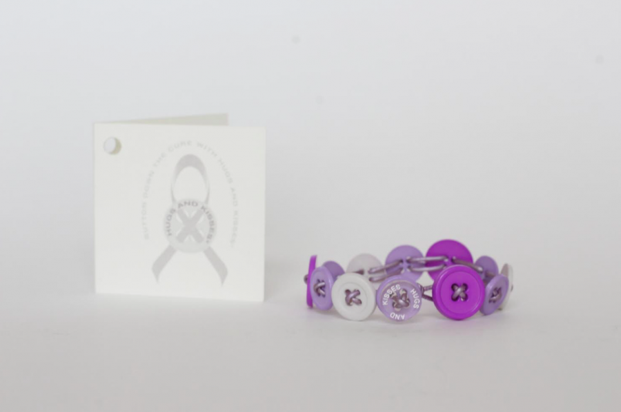 Hugs and Kisses bracelets (pictured) are available in a variety of colors and styles, and at least one button on each includes the name of the organization.