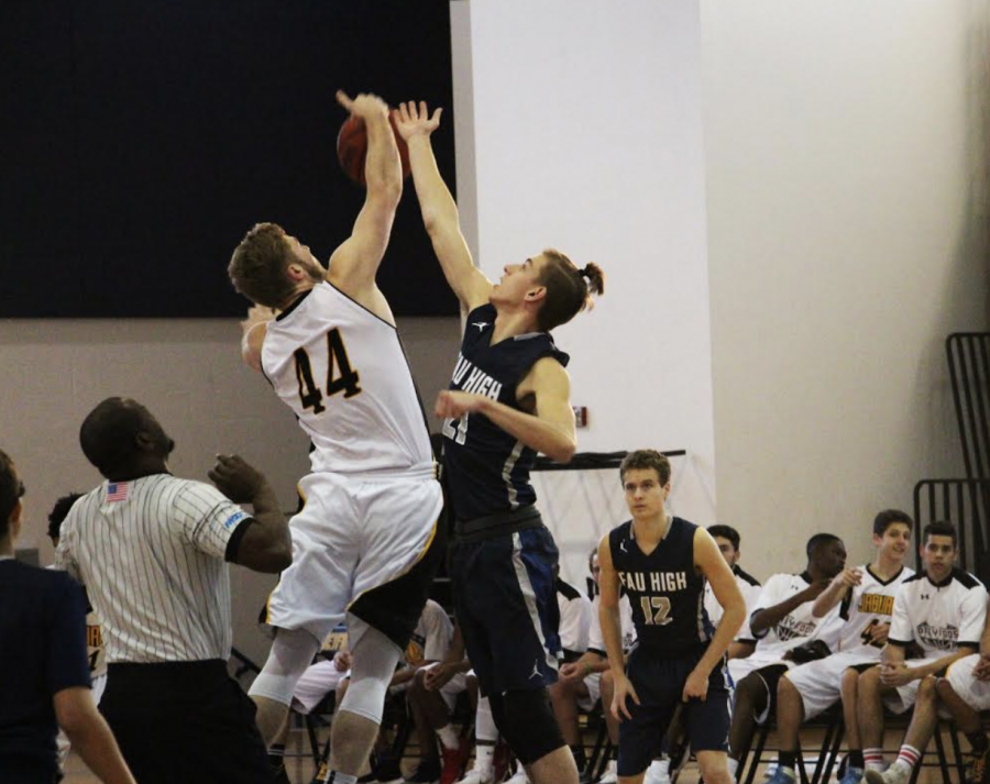 Visual senior Aaron Crawford wins the opening tip off against Florida Atlantic University High School (FAUHS) to get the game started. The Dreyfoos Jaguars would receive the first possession in a game that they have highly anticipated after beating FAUHS last year. 