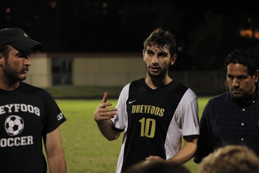 Communications senior and boys’ soccer team captain Zachary Stoloff talks to his teammates after the first half of their game against Lake Worth Community High School on Dec. 1. After falling behind 1-0 in the first half, Stoloff encouraged his team to push harder in the second half and gave individual players advice for improvement.