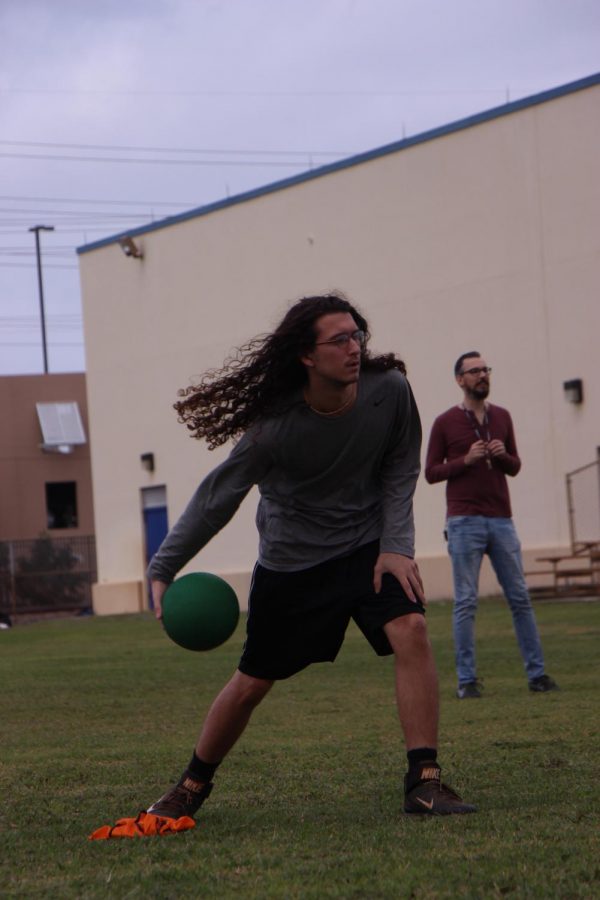 Visual senior Dalton Nellgar concentrates on pitching to the teacher team.