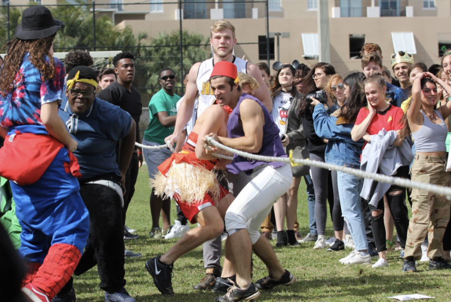 Visual senior Aaron Crawford and strings seniors Allen Cadet and Thomas Devito lead their team to victory during the tug o’ war competition at the end of lunch. The senior team first competed against the sophomores, and later the juniors to secure their win at the end of the match. 