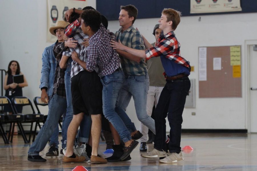 The freshmen dodgeball team celebrate defeating the junior class. Advancing to the final round against the seniors, the freshmen later lost, placing second in the tournament. 