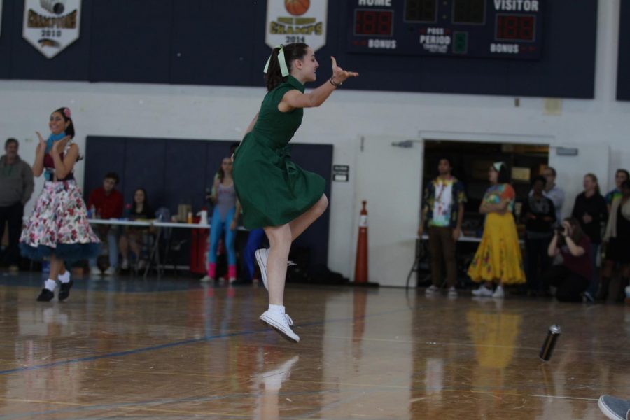 Dance sophomore Rachel Abelenda jumps to the beat of 60s tunes during the Generation Dance.  Abelenda not only participated in the Generation Dance and Pep Rally Dance, but choreographed Pep Rally as well.