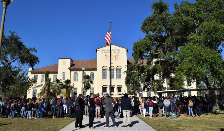 Students+and+faculty+participated+in+a+schoolwide+walkout+on+March+14%2C+which+consisted+of+speeches+from+students+and+17+minutes+of+silence+in+honor+of+the+17+victims.+%E2%80%9CI+was+just+thinking+about+the+victims%2C%E2%80%9D+communications+senior+Zachary+Stoloff+said.+%E2%80%9CFor+each+minute%2C+representing+each+victim%2C+I+would+keep+their+name+in+my+mind%2C+and+think+about+who+they+were+as+people+from+the+countless+stories+I+heard+on+the+news.%E2%80%9D++After+the+moment+of+silence%2C+Principal+Dr.+Susan+Atherley+delivered+tear-jerking+words+about+how+unimaginable+it+would+be+to+lose+Dreyfoos+students.