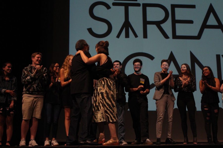 Students show their appreciation for former communications teacher Ancil Deluz during the closing applause of Streaming Canvas. “I was really happy to see him come back and support dreyfoos film and it made my heart warm to see his smiling face,” communications senior Gina Givens said. “He taught me so much about film, but the main thing I learned is that film is all about love and compassion towards the people around you and the world.” Mr. Deluz taught at Dreyfoos since it was founded, and he retired just last year. Communications teacher Ruby Hernandez made the transition to becoming a teacher, as opposed to an artist in residence, this year, assuming the responsibilities of the film festival alongside artist in residence Alisha Snyder. 