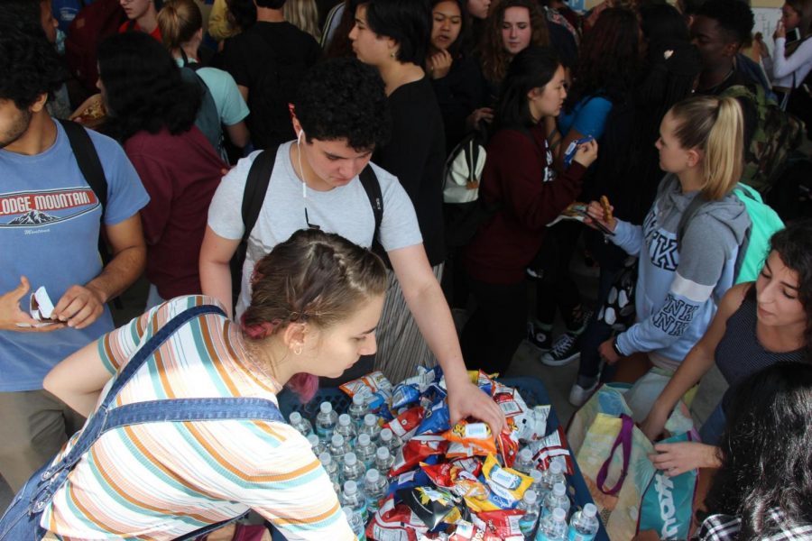 Students receive edible handouts from SGA and Class Council around the cafeteria during lunch. Throughout the week, candidates passed out a multitude of treats in order to entice voters. 
