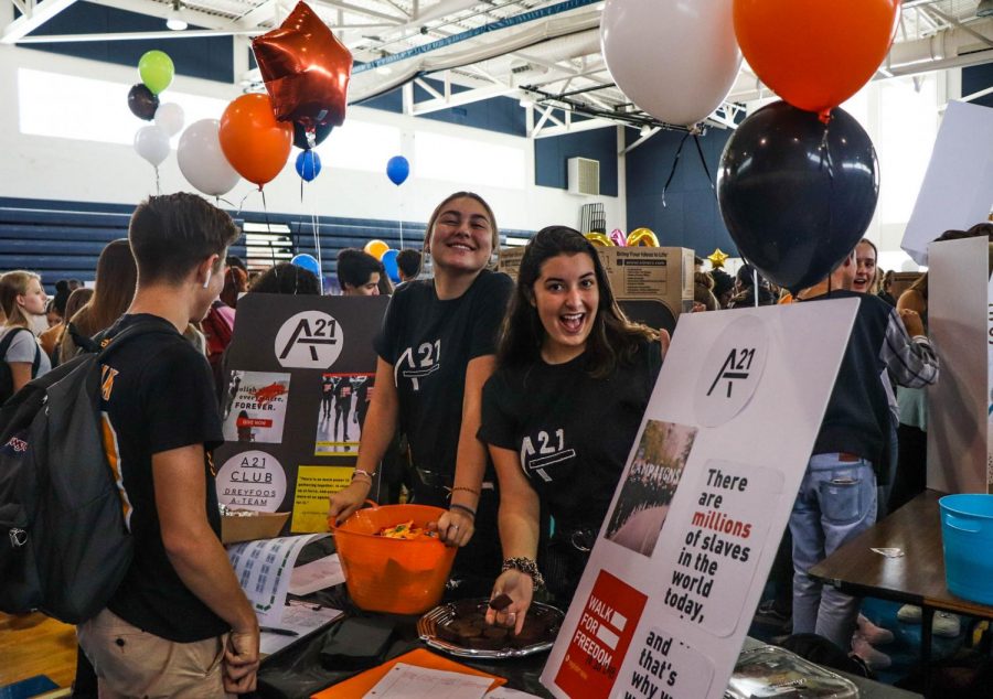 Dance junior Fiona Campanella and communications senior Gabby Moragues introduce their chapter of The A21 Campaign for the first time during Club Rush on Sept 12 in the gym. “A21 is about stopping human trafficking worldwide,” Moragues said. “We try to spread information and do what we can to resolve the issue.”
