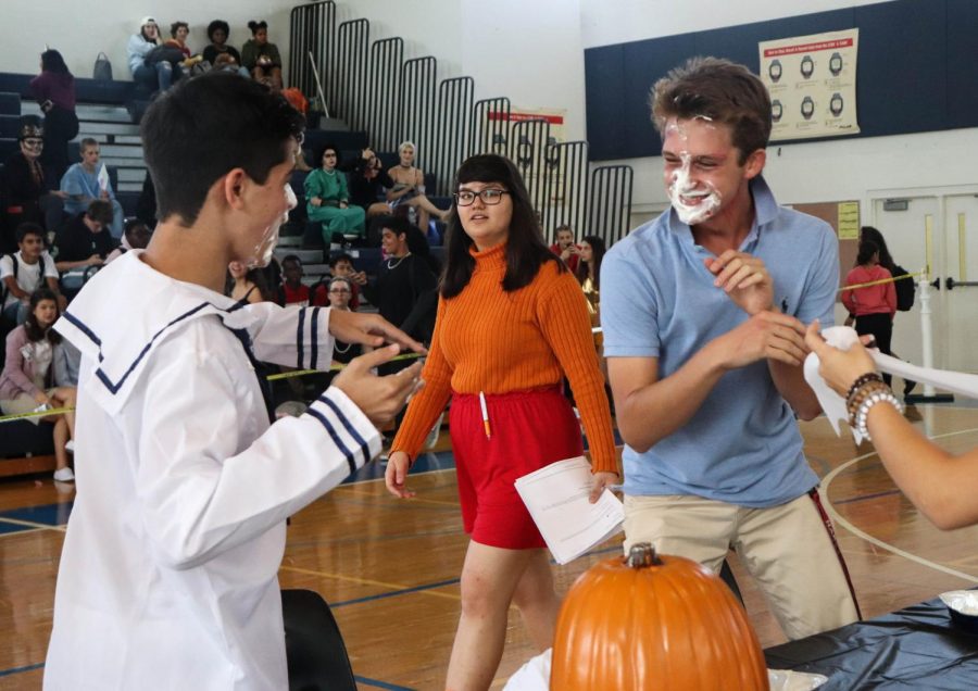 Theatre sophomores Cooper Musser and Aaron Idlis grin with mouths full of whipped cream, realizing that they just brought home more points for the sophomore class. “My favorite part [of Fall Festival] was definitely the pie eating contest because it was the most fun out of all of them, and the most engaging, and I ate a lot of whipped cream so that was cool,” Musser said. “It was definitely pretty tricky though, because I couldn’t see anything and I was kind of just scavenging around.”