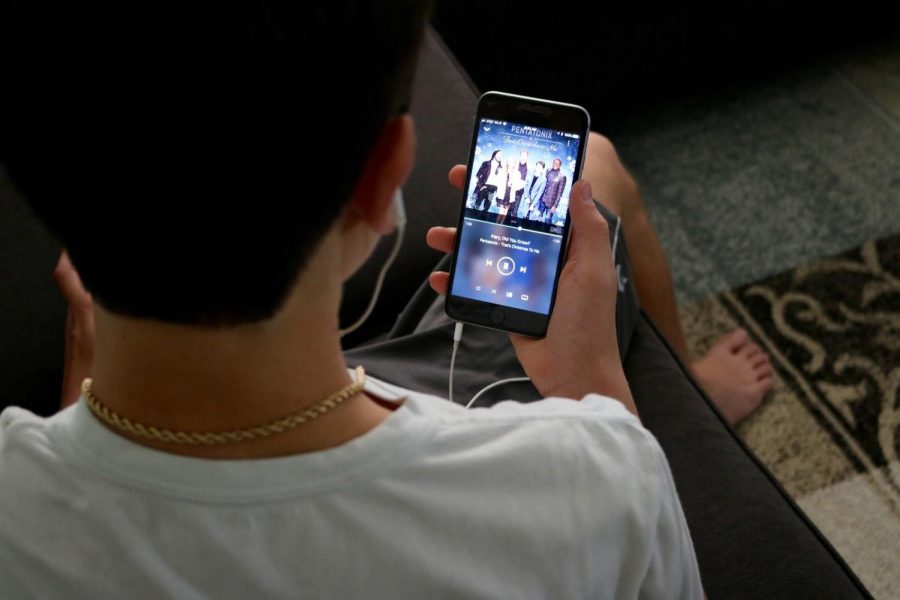 Communications junior Nikolas Zimmerman listens to “Mary, Did You Know?” by Pentatonix before Thanksgiving. 