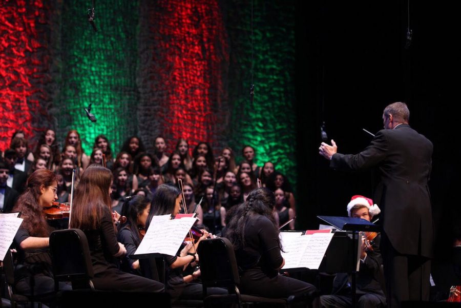 Vocal teacher Kent Taylor directs vocal and strings students in the opening number of the annual Prism concert at the Kravis Center for the Performing Arts. “We’re on the Kravis Center stage, which is a lot different because it’s a whole entire auditorium,” vocal senior Carolyn Lord said. “It’s really nice to have family and friends and the school to come watch.”