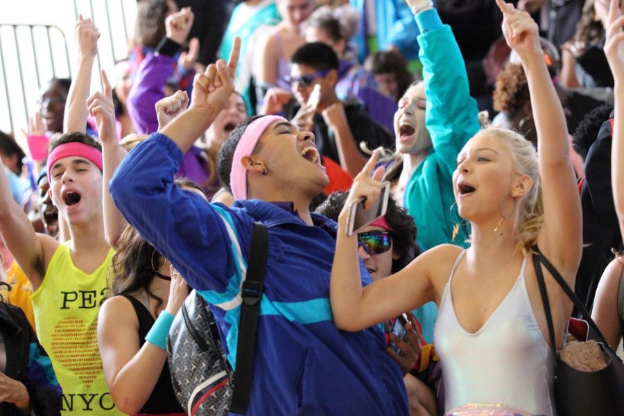 Pointing his finger up in the air, theatre senior Jaden Martinez cheers alongside fellow seniors after winning first place for their 80’s Generation Day dance. Shortly after, it was announced that there was a mishap in the judges’ scoring and that the juniors tied with the seniors.
