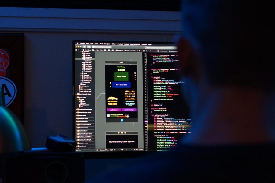 Lines of code fill vocal junior Ben Myer’s desktop monitor. Among his projects is a mobile application called Chest-Quest. Myer’s coding career began in early middle school, “but then I had the confidence to start working with other coding languages. I learned HTML, C# with Unity, and Swift after that.” 