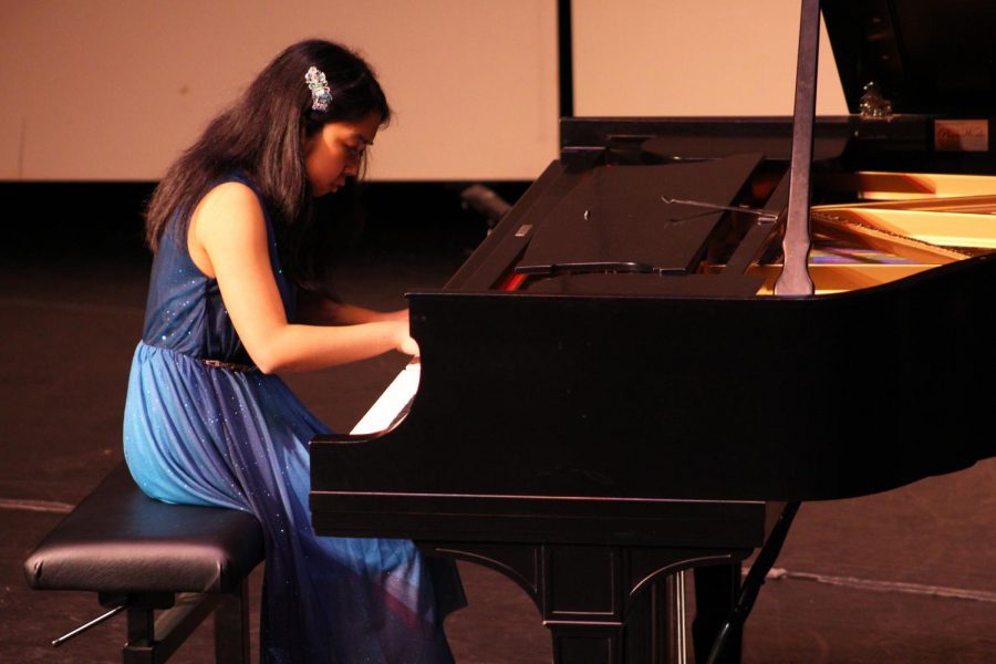 Piano sophomore Maria Annica Matig-A plays Prelude and Fugue in d minor, BWV 851 by Bach. It was the final piece she played during “Rach On,” after “Pathetique” Sonata Op. 13 No. 8 in c minor (Movements 2 and 3) by Beethoven. “Even though I had some rough spots, I really liked the performance overall,” Matig-A said. “Even though the spotlight was on me and everyone’s stares were just locked on me, I’m just being myself.”