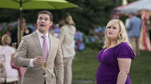 Natalie (Rebel Wilson) and Josh (Adam DeVine) have a conversation about relationships as Josh prepares to marry Isabella (Priyanka Chopra) in the alternate rom-com universe depicted in the film.