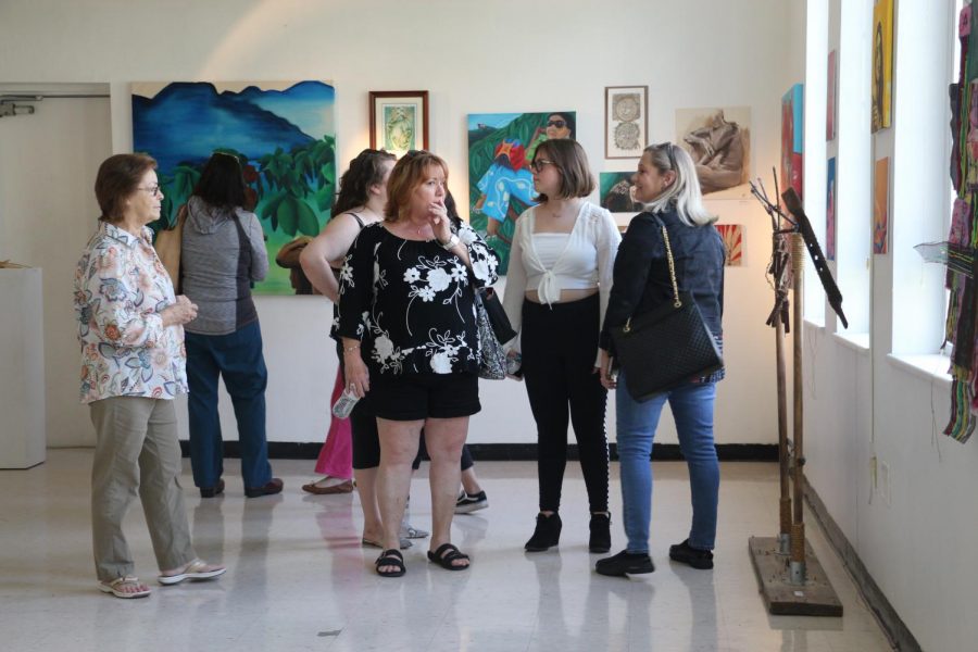 Digital media and visual students, alongside their parents and faculty members, wander the halls of Building 9. The gallery featured over one hundred pieces, including sculptures, paintings, and sketches.  