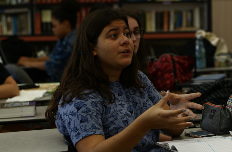 Representing+Greece%2C+visual+junior+Ana-Gabriella+Thomidis+uses+her+background+on+the+country+and+her+heritage+to+take+a+stance+on+the+resolution.+She+was+drawn+in+by+the+complimentary+lunch+and+NHHS+hour+opportunity%2C+but+after+attending+she+decided+to+become+more+involved+in+MUN.+%E2%80%9CI+originally+chose+to+represent+Romania%2C+but+%E2%80%A6+there+wasn%27t+a+lot+of+information+about+it%2C+and+my+Greek+heritage+was+easier+for+me+to+talk+about%2C%E2%80%9D+Thomidis+said.+%E2%80%9CIt+gives+you+perspective+about+how+other+countries+may+think+and+some+resolutions+that+are+passed+that+you+don%27t+even+know+happened+in+the+UN.%E2%80%9D+