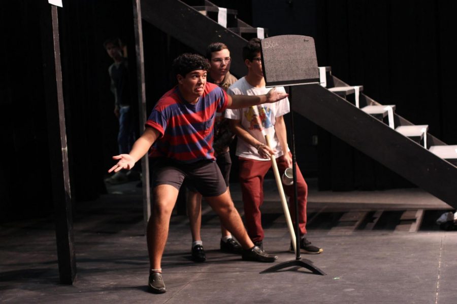 Theatre junior Juan Carlos Romero, freshman Alrik Blanchard, and sophomore Aaron Idlis musically narrate Amélie’s father’s introduction in rehearsals for “Amélie.” “Amélie” is the first full-scale musical to occupy the Brandt Black Box Theater, complete with a 12-piece band and multi-leveled set.