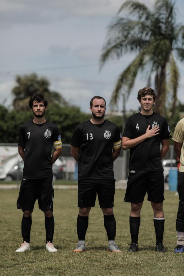 Steffan Gawlikowski, center, stood alongside his teammates, as he prepared to walk onto the field to begin the game. 