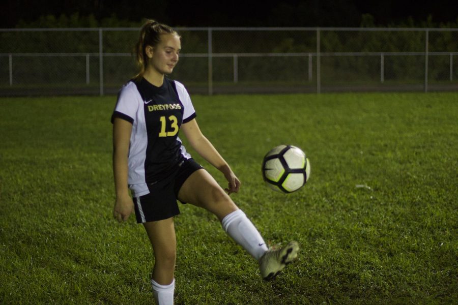 Playing left back, theatre sophomore Grace Trainor juggles the soccer ball during warm-ups in preparation for their game against Santaluces High School. “It was a good season opener,” Trainor said in reference to their tie. “We have a lot to work on.”
