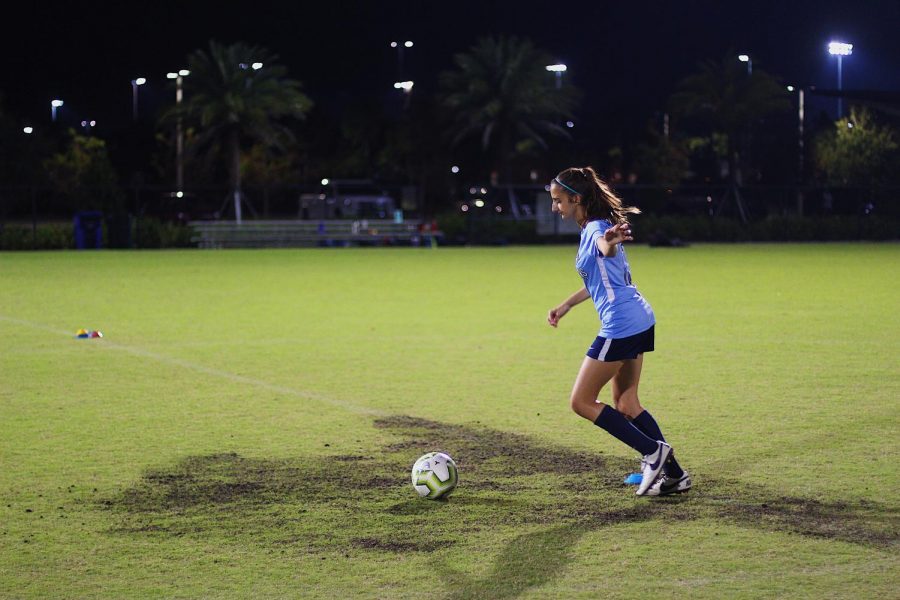 Band freshman Ava DeGaetano trains at Gardens District Park three times a week after school. She balances her busy schedule to fit in her two-hour practices. “Practices are my favorite part of the day,” DeGaetano said. “I love playing with my teammates.” 