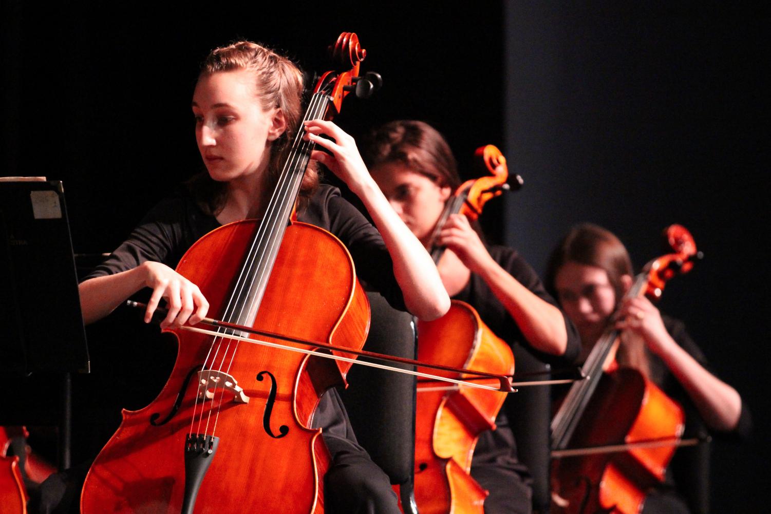 Strings students play cellos in the Strings Orchestra Concert, held in Meyer Hall at 6:30 p.m. on Dec. 12. “The first theme [of Tchaikovsky’s “Serenade”] follows and contains a particularly athletic passage for the cello section, playing scores of fast notes underneath a slower moving passage in the upper strings,” according to Dr. Anthony Suter, composer and Associate Professor of Music at the University of Redlands.