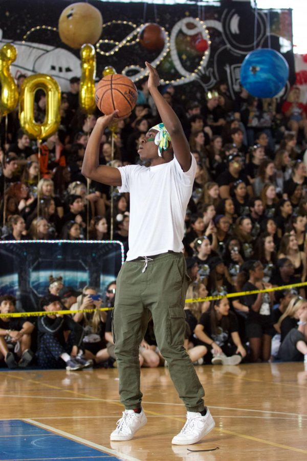 Piano Sophomore Chris Samuel shoots free throws in the basketball game an attempt to win for his class.”I thought I was gonna do better than I actually did,  Samuel said. Yeah, I did it, I made seven, but I was planning to make more. I’m hard on myself for that.”