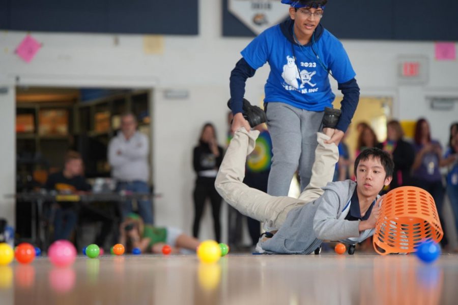 Freshman Class Council President Jayantha Kantamneni rolls his co-president Nam Tang around in a game of Hungry,Hungry Hippos.