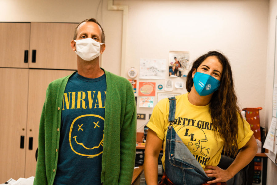 Nathan Hesse and Carmen Gallardo throw back to 1990’s grunge with a Nirvana t-shirt, overalls, and a flannel. The term grunge originated as a descriptor for an emerging style of music popularized by Nirvana, Pearl Jam, and Soundgarden, which grew into a genre of clothing that considered itself “anti-fashion.” Photo by Allison Robbert.