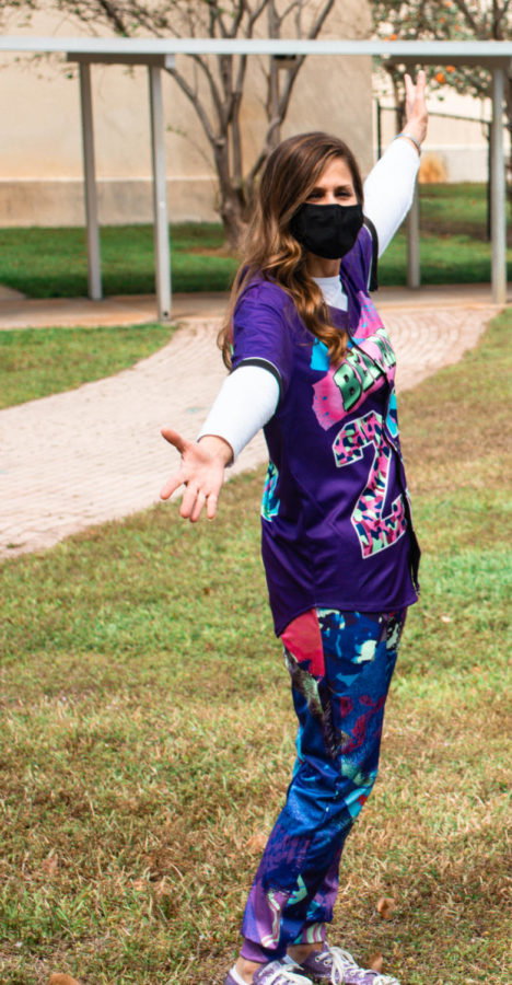 Principal Blake Bennett sports graphic pants and a jersey to pay homage to the 1980s. Photo by Allison Robbert.